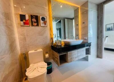 Modern bathroom with stylish vanity mirror and toilet