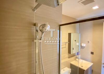 modern bathroom with glass door shower and vanity
