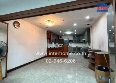 Spacious kitchen area with modern fixtures and ample storage