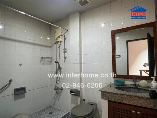 Bathroom with shower and vanity