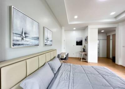 Modern bedroom with artwork and neutral colors