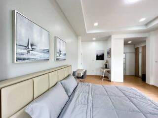 Modern bedroom with artwork and neutral colors