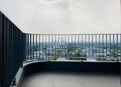 A spacious balcony with a panoramic city view