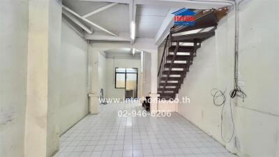 Interior view with staircase and tiled floor