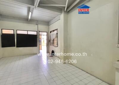 Unfurnished interior space with tiled floor