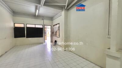 Unfurnished interior space with tiled floor