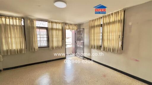 Bright living room with windows and tiled flooring