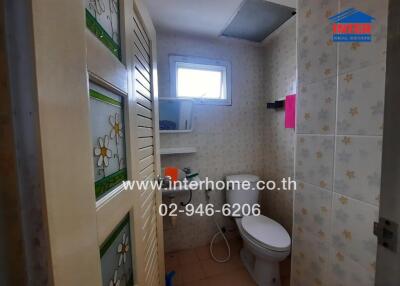 Bathroom with toilet and window