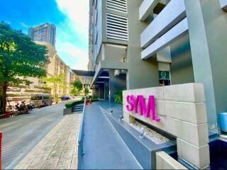 Modern building exterior with signage and street view