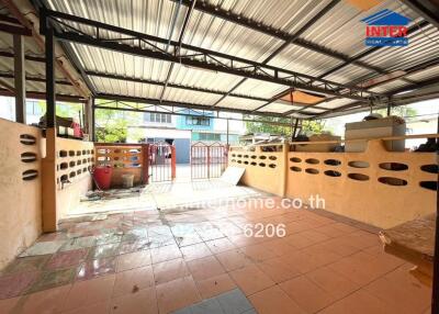 Outdoor covered area with tiled floor