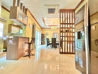 Spacious dining area with adjacent kitchen and bar