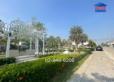 Outdoor garden area with walkway and pavilion