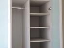 Open closet with various shelves and compartments