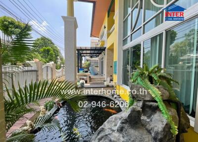 Outdoor area with garden and fish pond