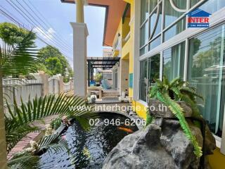Outdoor area with garden and fish pond