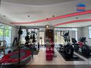 In-house gym with various workout equipment including exercise machines and weights