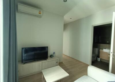 Living room with TV and air conditioner