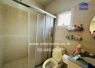 Bathroom with shower, toilet, and sink