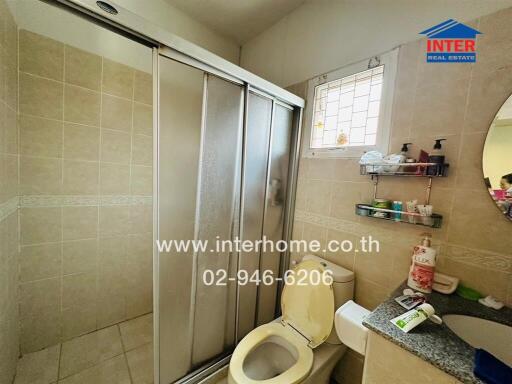 Bathroom with shower, toilet, and sink