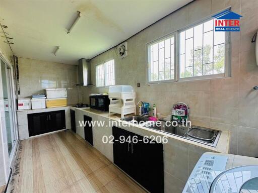 Modern kitchen with windows and countertop space