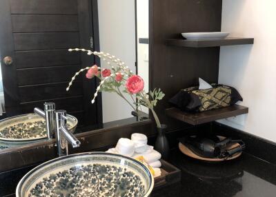 Bathroom with modern sink and decorative accessories