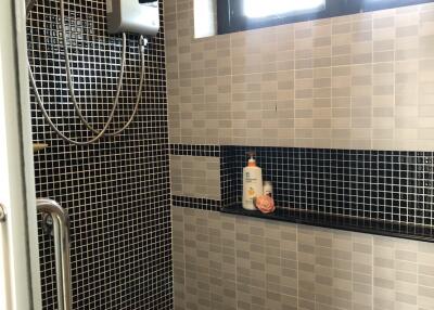 Modern bathroom with black and white tile design