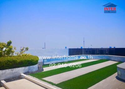 Rooftop garden with greenery and paved walkways