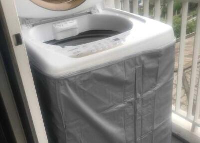 Washing machine in an outdoor laundry space