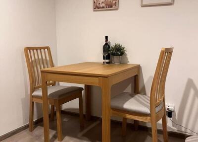 Small dining area with wooden table and chairs