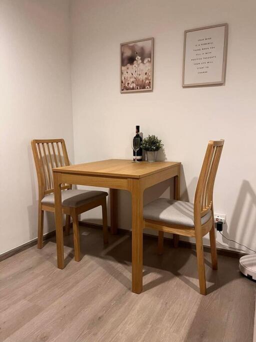 Small dining area with wooden table and chairs