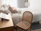 Bedroom with bed, desk, chair and large window