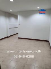 empty room with tiled floor and white walls