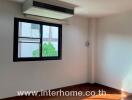 Bedroom with parquet flooring and a window