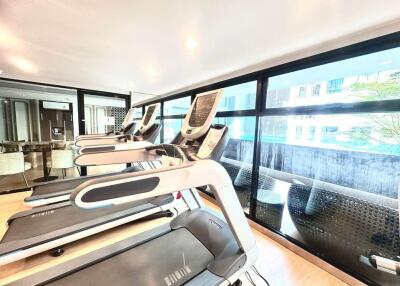 Gym with treadmills and large windows