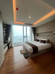 Modern bedroom with ocean view and desk