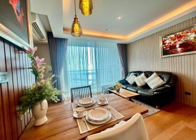 Modern living room with dining area and balcony view