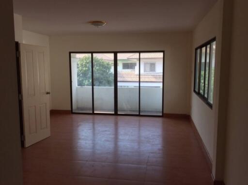 Spacious living room with large windows and natural light