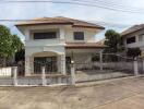 Two-story house with gated entrance