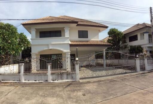 Two-story house with gated entrance