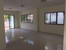 Spacious living area with large windows and natural lighting