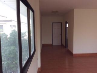 Empty hallway with windows and doors