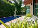 Poolside view with lush greenery