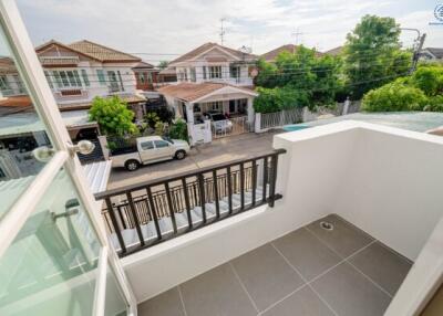 Balcony with railing overlooking residential area