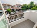 Balcony with railing overlooking residential area