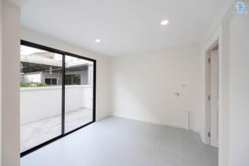 Bright and spacious living room with large glass sliding doors