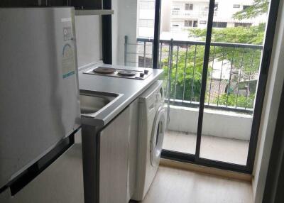 Modern kitchen with balcony and washing machine