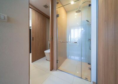 Modern bathroom with shower and wooden accents