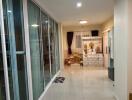 Spacious hallway with glass sliding doors and modern decor