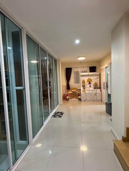 Spacious hallway with glass sliding doors and modern decor