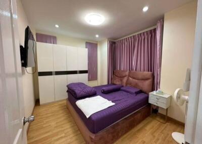 Modern bedroom with purple decor